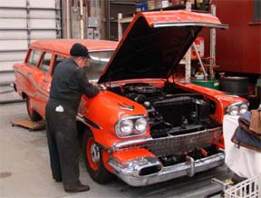 Duncan working on Car 26 engine. Duncan working on Car 26 engine.